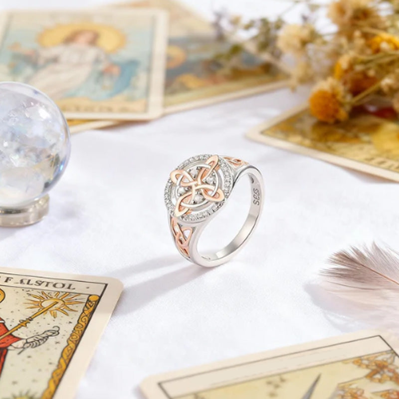 Elegant two-tone ring with Celtic knot and zirconia